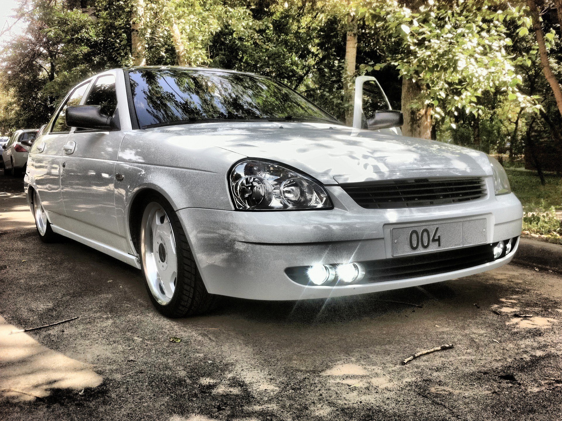 silver sedan with custom wheels