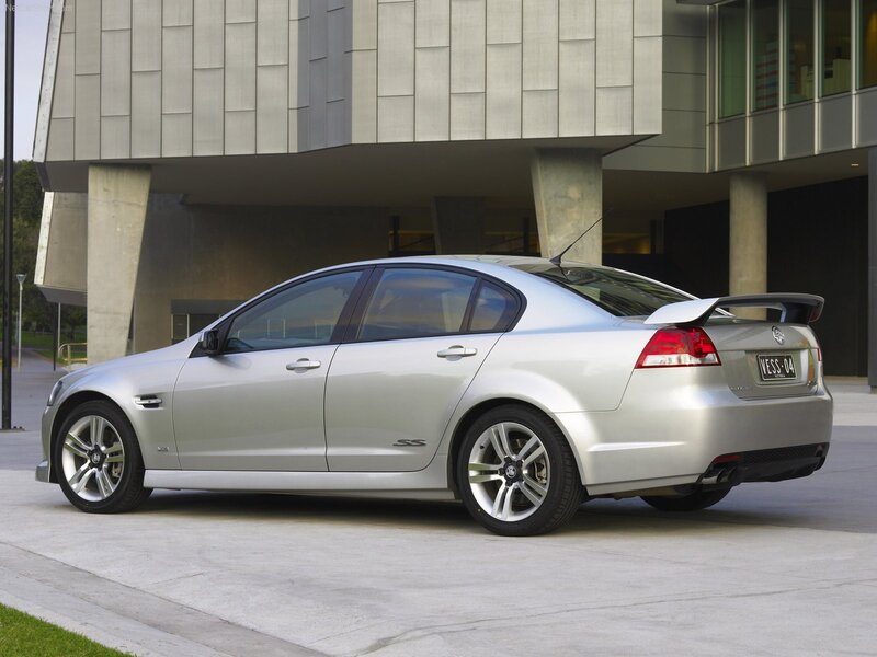 silver sedan with rear spoiler