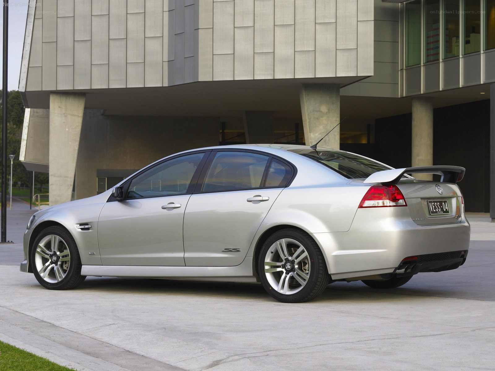 silver sedan with rear spoiler