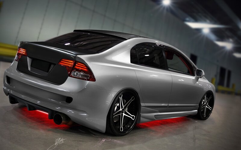 silver sedan with red underglow
