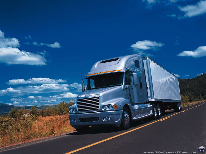 silver semi-truck on highway