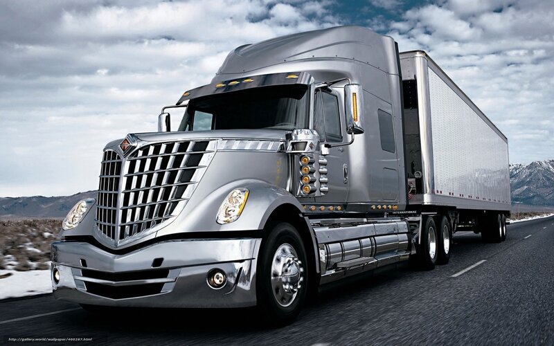 silver semi-truck on highway