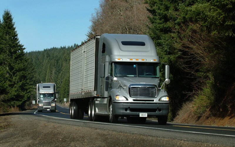 Silver Semi-trucks on Road