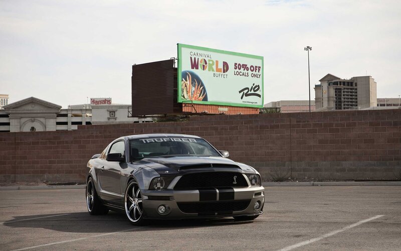Silver Shelby Mustang in parking lot