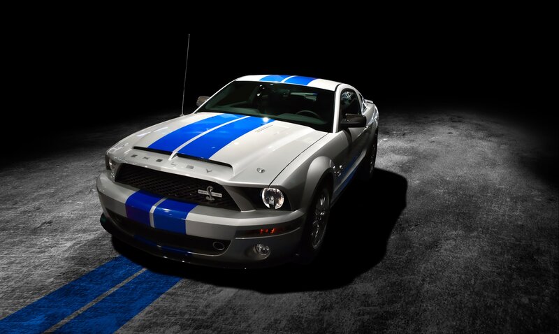 Silver Shelby Mustang with blue stripes