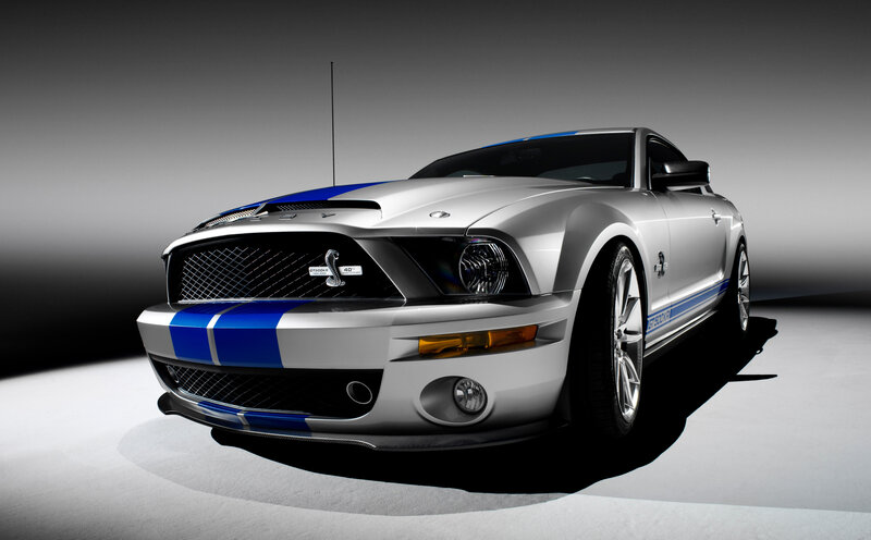 Silver Shelby Mustang with blue stripes