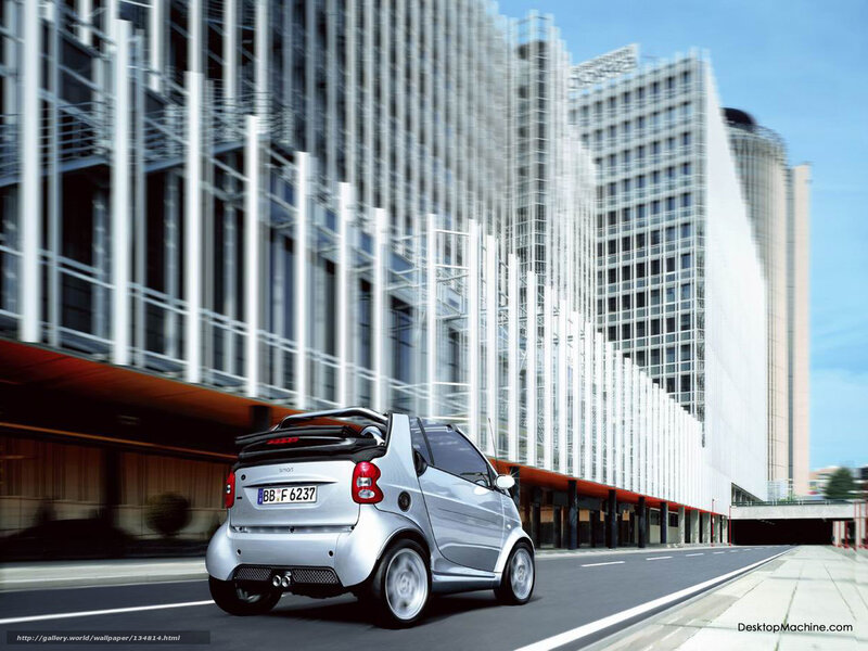 Silver smart car in city