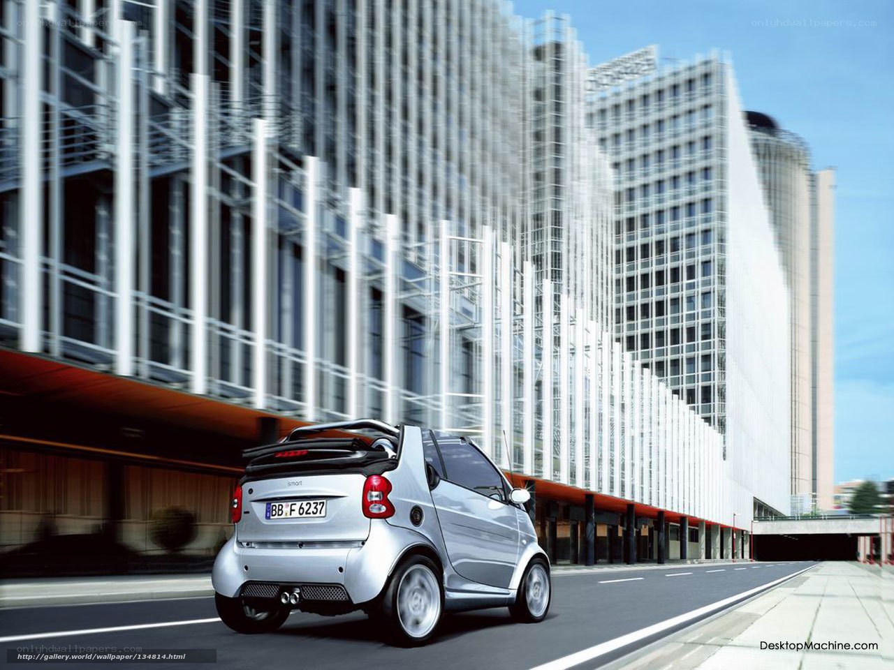 Silver smart car in city