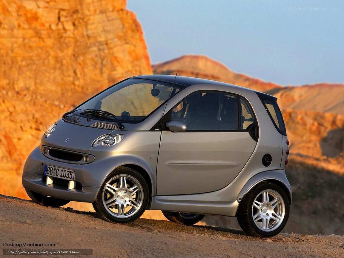 silver smart car in desert