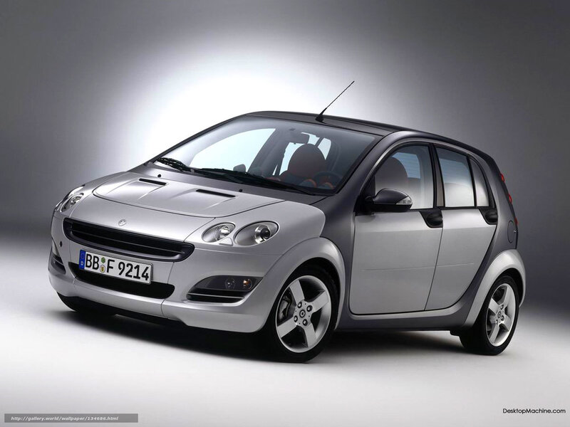 silver smart car in studio