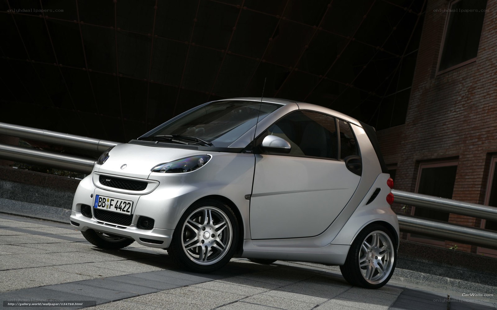 silver smart car on city street