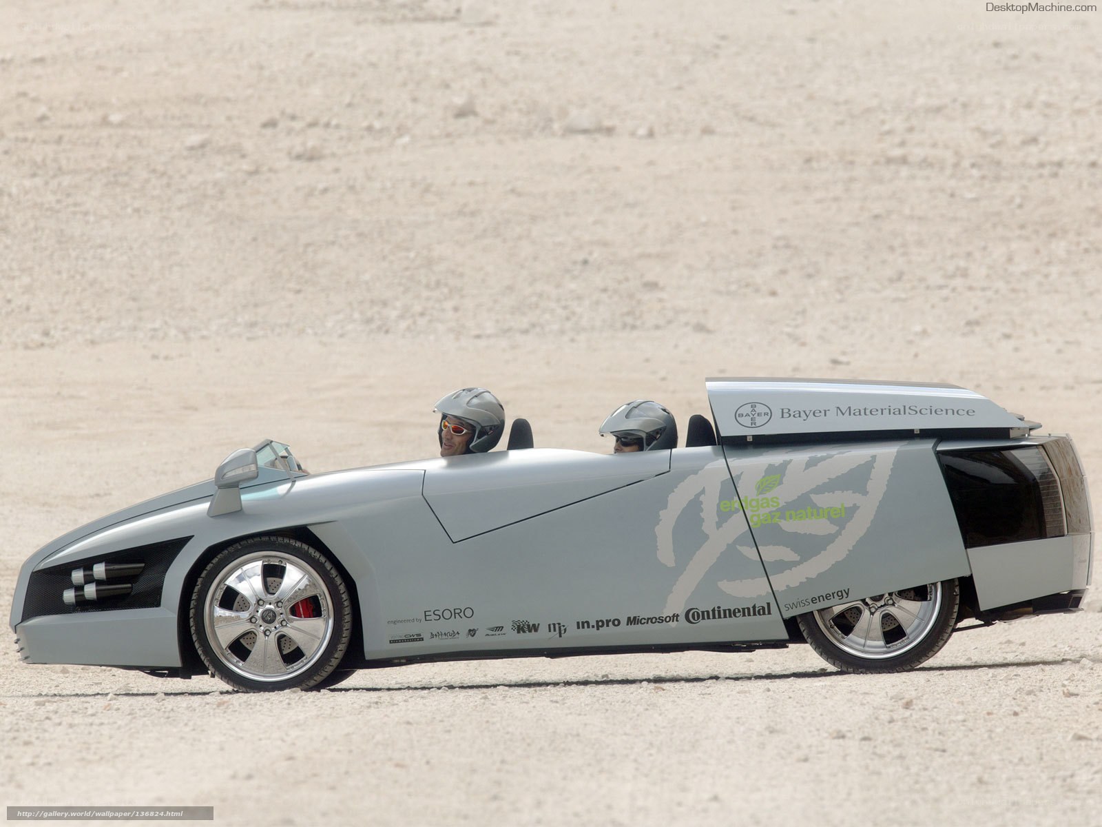 Silver solar car on desert track