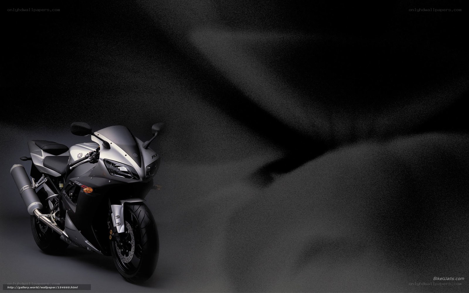 Silver sport motorcycle on dark background