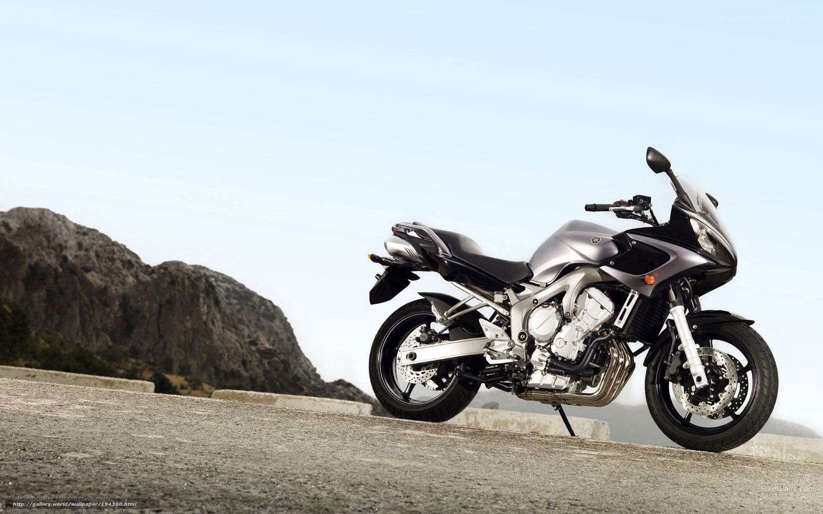 silver sport motorcycle on road
