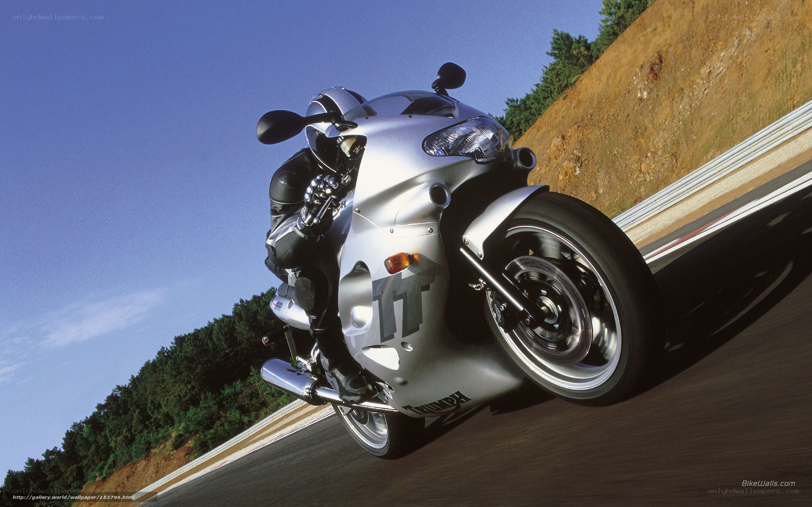 silver sport motorcycle on track