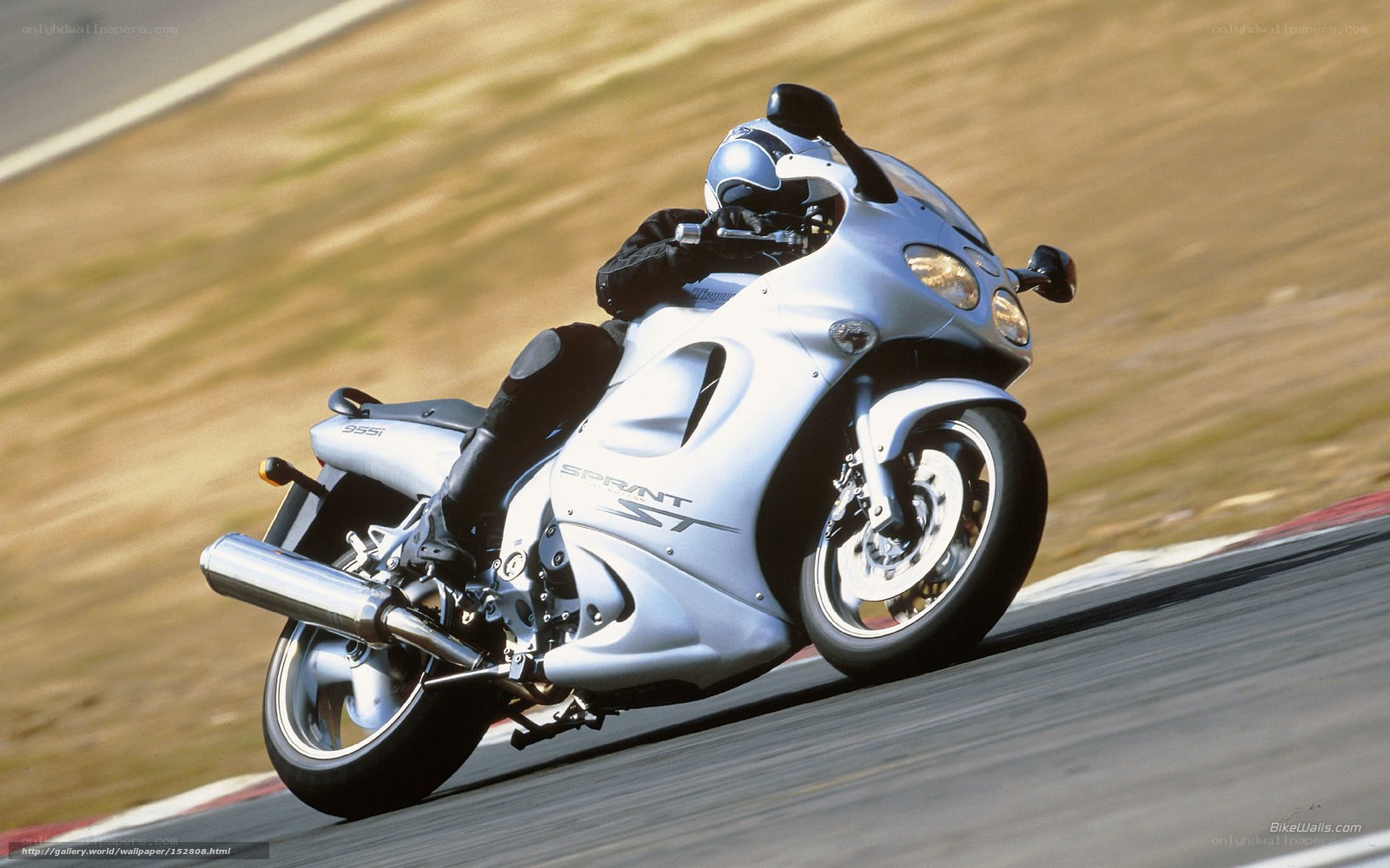 silver sportbike on racetrack