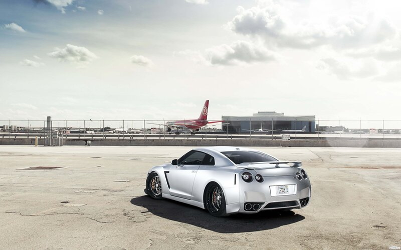 Silver sports car at airport