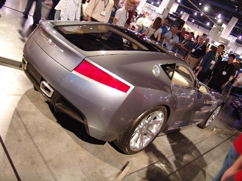 silver sports car at auto show