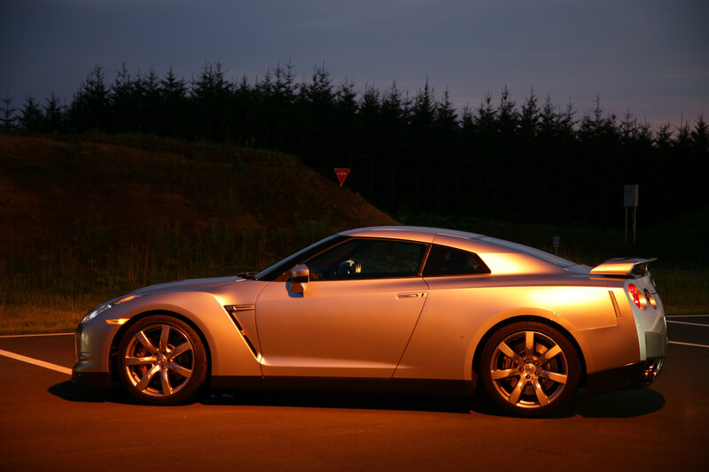 silver sports car at dusk