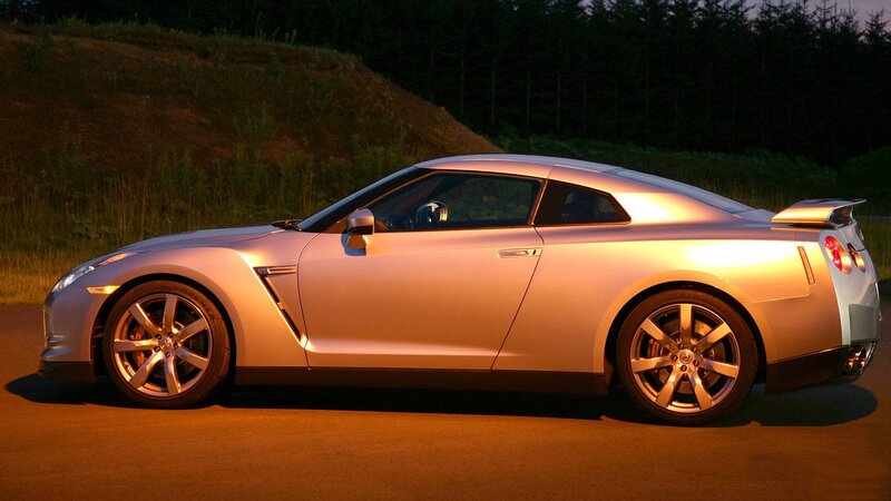 silver sports car at dusk