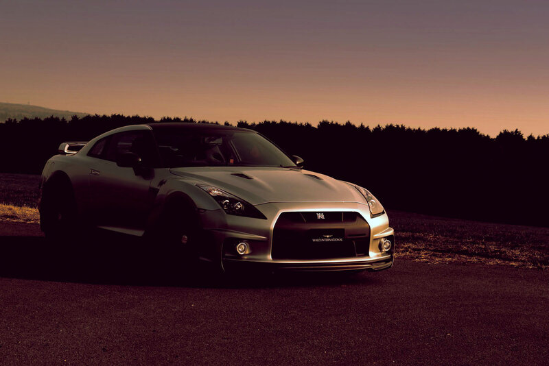 silver sports car at dusk