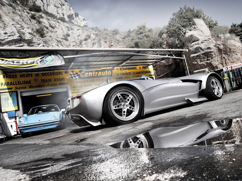 Silver sports car at garage
