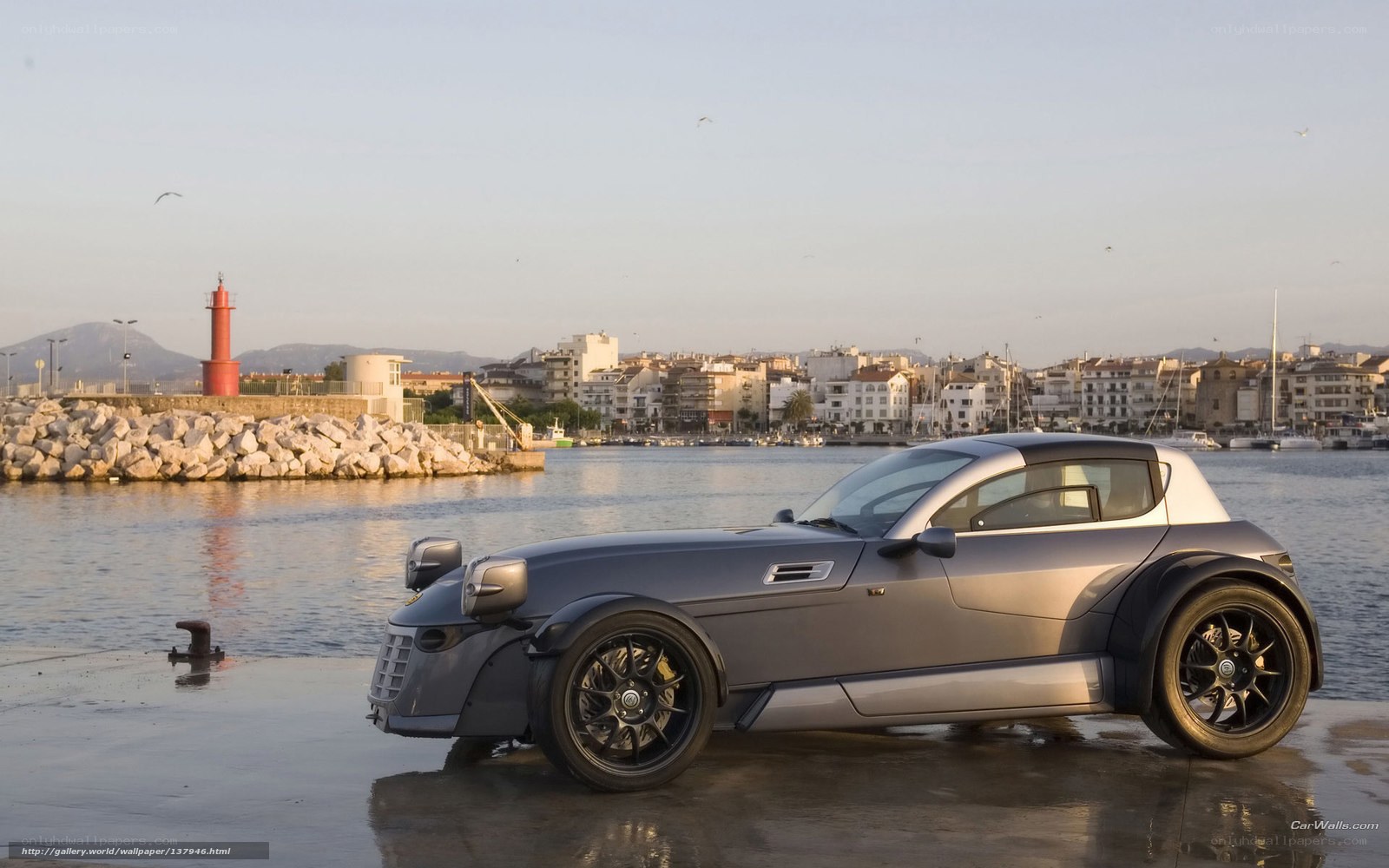 Silver sports car at harbor