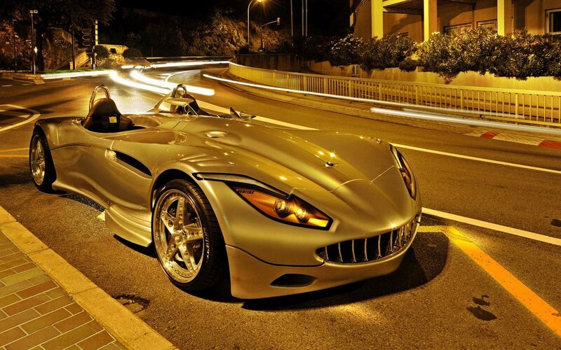 Silver sports car at night