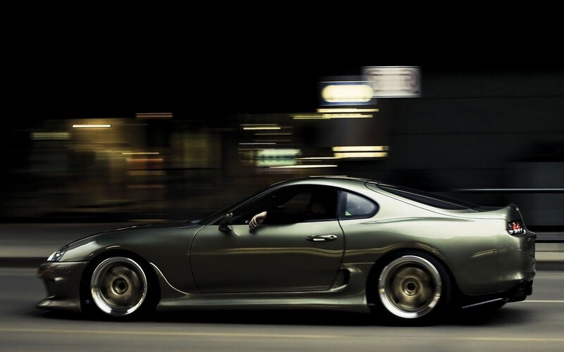 silver sports car at night