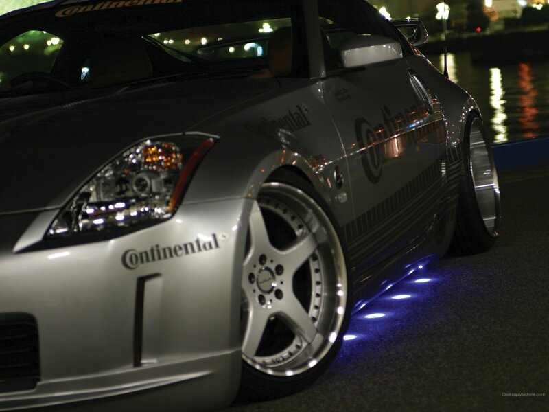 silver sports car at night