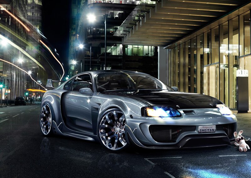 Silver sports car at night