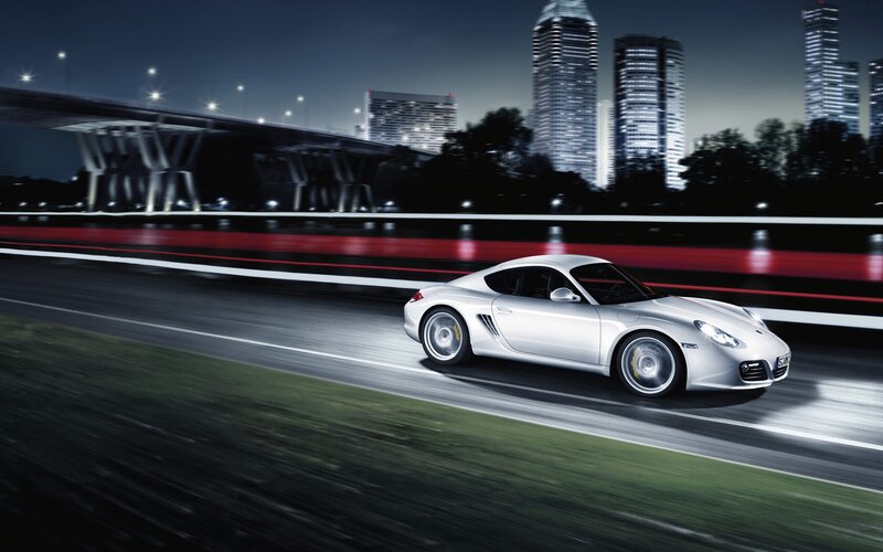 Silver sports car at night