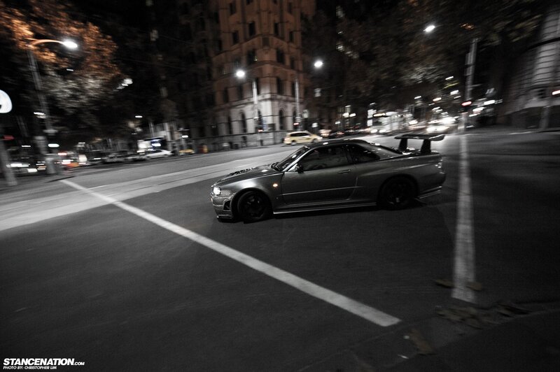 Silver sports car at night