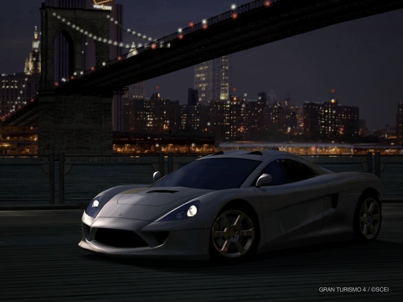Silver sports car at night