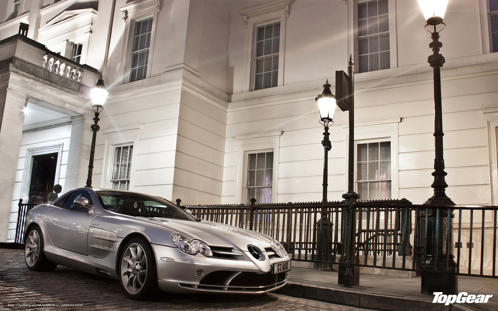 Silver sports car at night