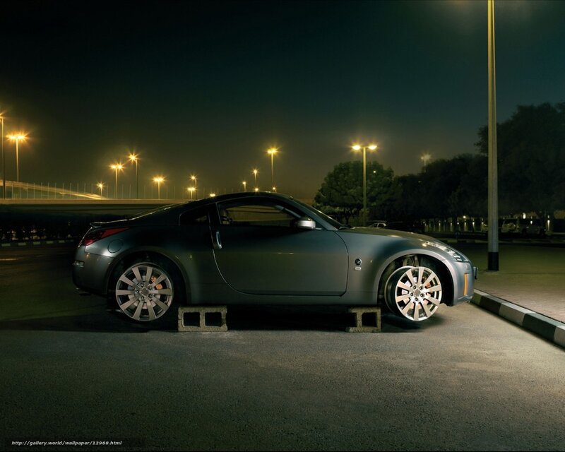 Silver sports car at night