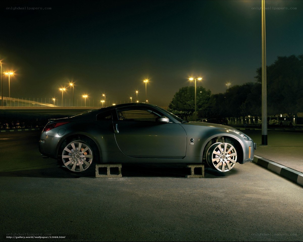 Silver sports car at night