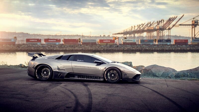 silver sports car at port