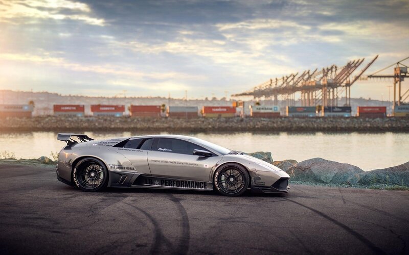 silver sports car at port