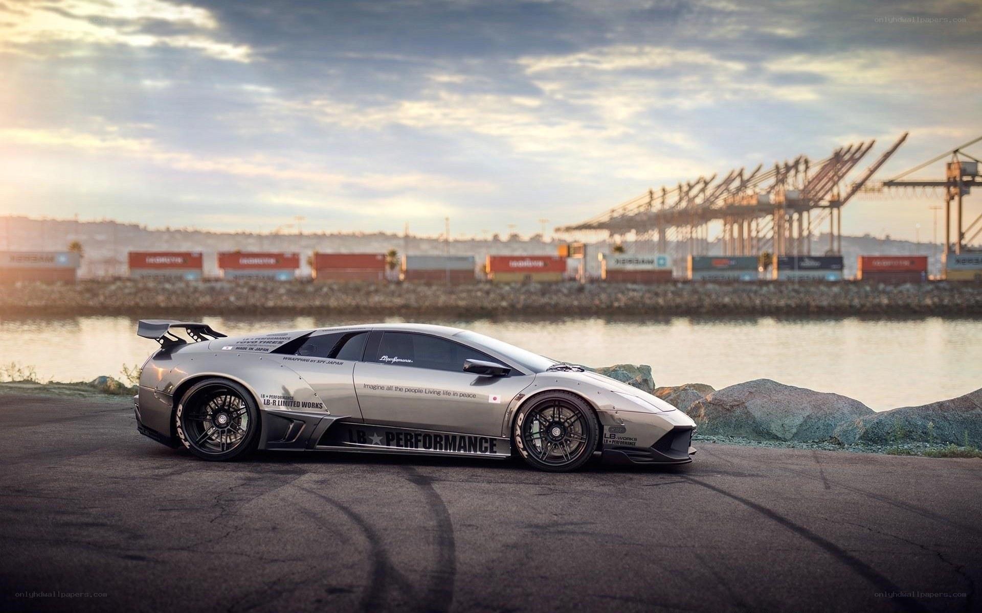 silver sports car at port