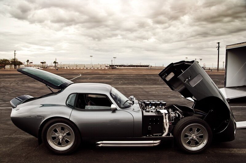 silver sports car at racetrack