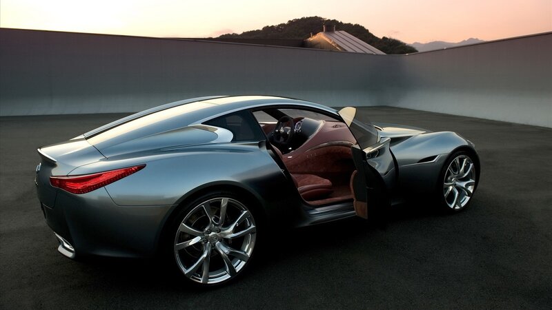 silver sports car at sunset