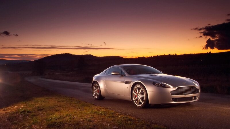 silver sports car at sunset