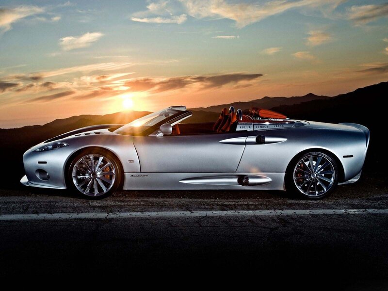 Silver sports car at sunset