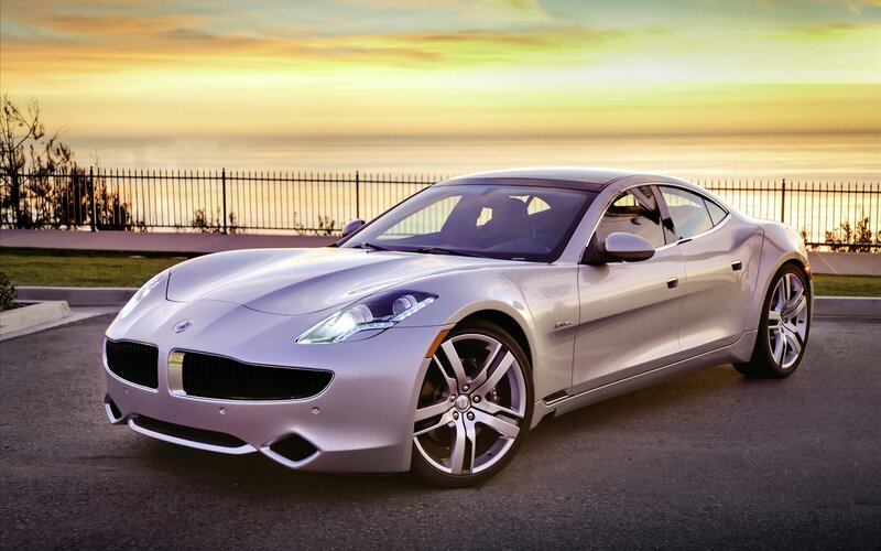 silver sports car at sunset
