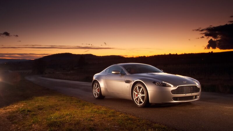Silver sports car at sunset