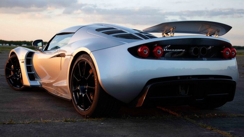 silver sports car at sunset