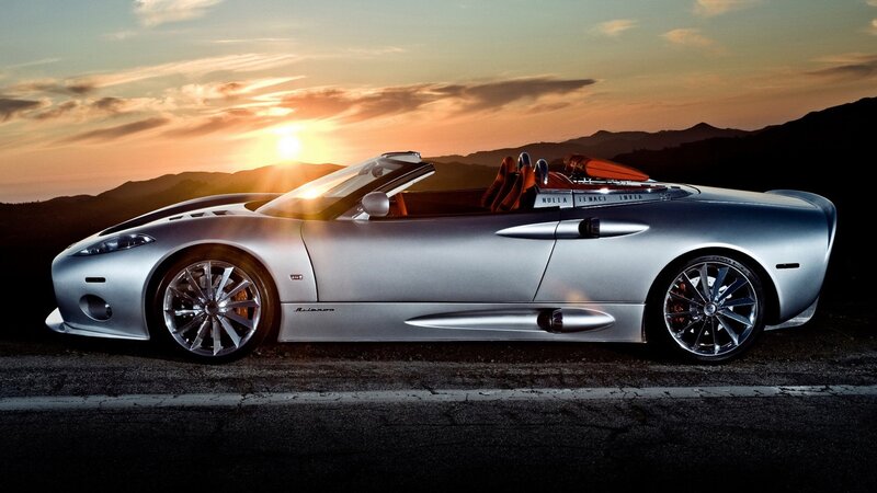 silver sports car at sunset
