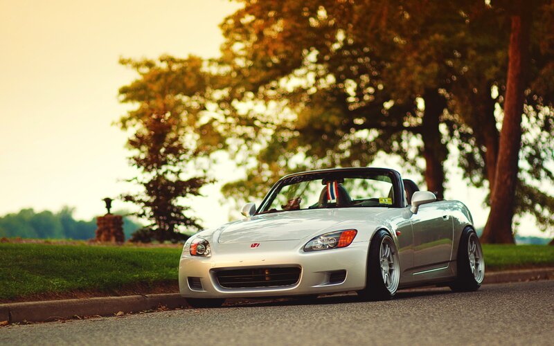 silver sports car at sunset