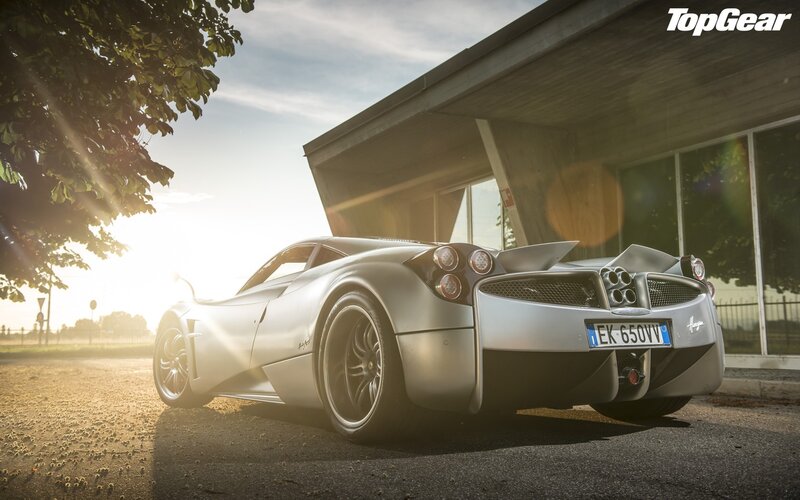 silver sports car at sunset